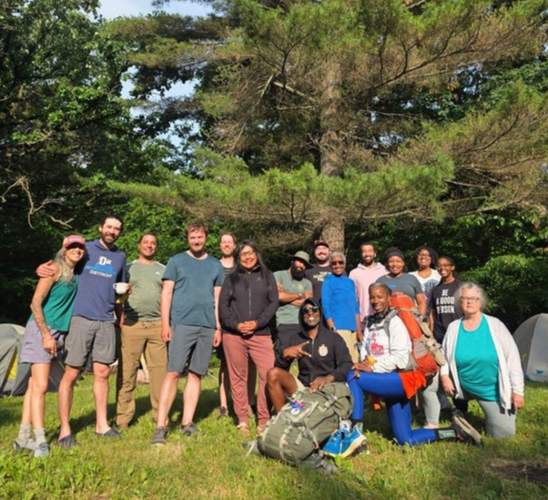 Participants and leaders collaborating outdoors